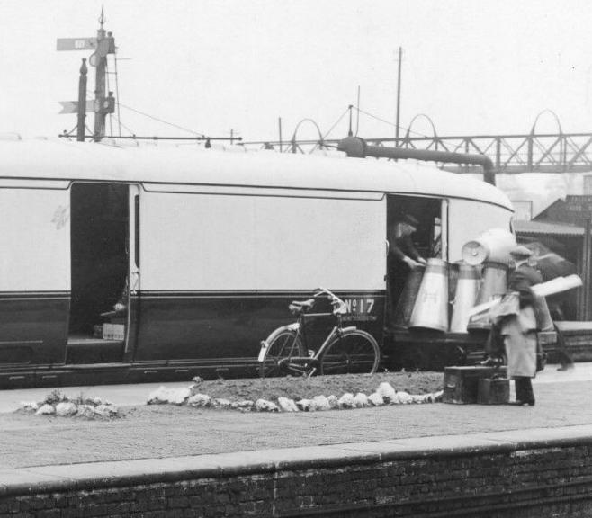 milk churns being loaded onto GWR Express Railcar 17